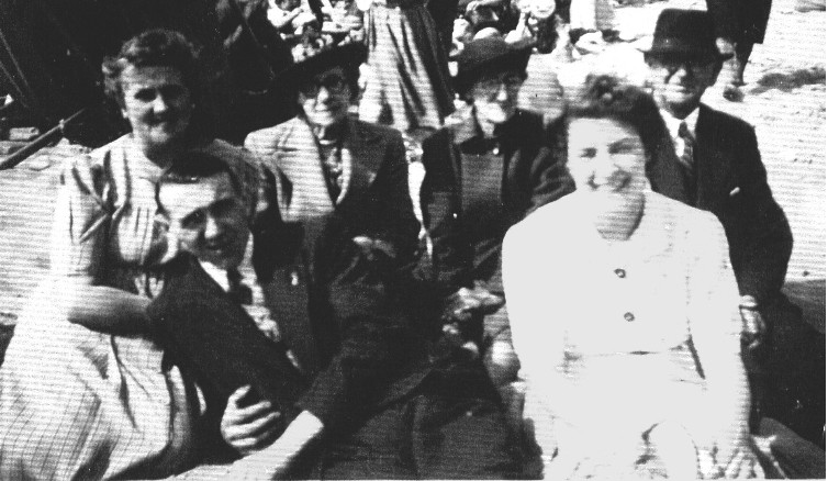 Agnes (nee Bevan) Rowe, Ruth Thomas, Mary (nee Thomas) Bevan, George Bevan, Tom Bevan and Nancy (nee Gilbourne) Bevan dressed up on the beach at Swansea