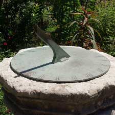 Sundial showing the time by casting a shadow which moves as the earth rotates