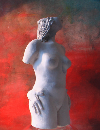 small clay figure; female torso/