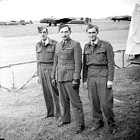 outside "B"Flight hangar about July '43,the three of us,I forget the fellows name on the left but the other is Arnold Pearson and myself,then Arnold and Davie Dunlop.